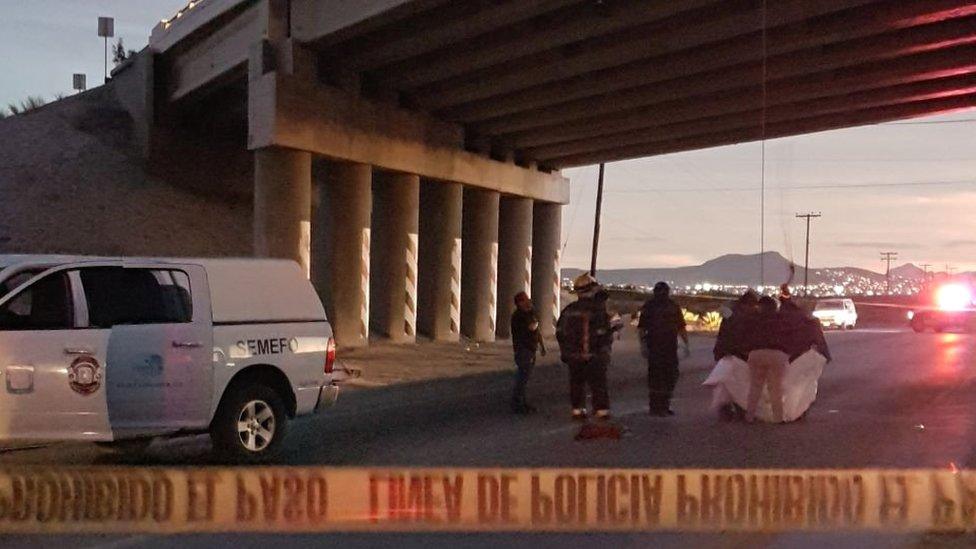 Rescuers retrieve bodies that were hanged on the motorway to La Paz, Baja California Sur, Mexico, 20 December 2017