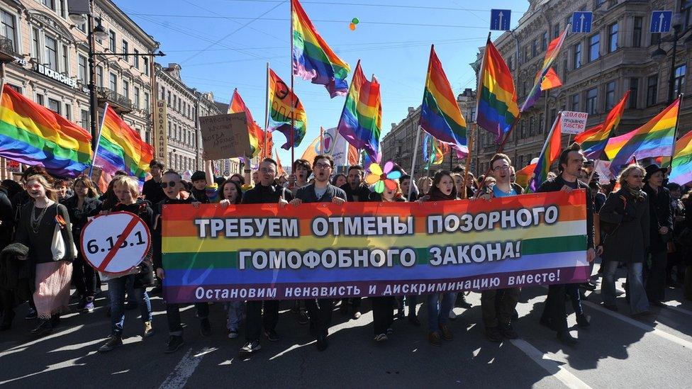 Gay rights activists march in St. Petersburg, Russia against a controversial law that activists see as violating the rights of gays.