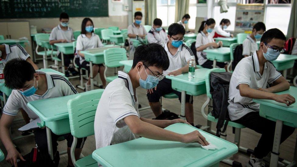 Senior middle school students prepare for class in Wuhan, China's central Hubei province on May 20, 2020