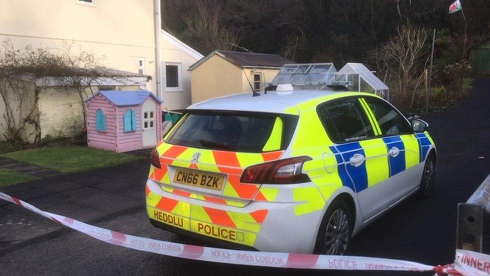 Police car outside house