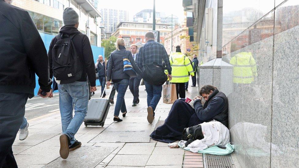 Homeless man and dog on street in Birmingham in 2018