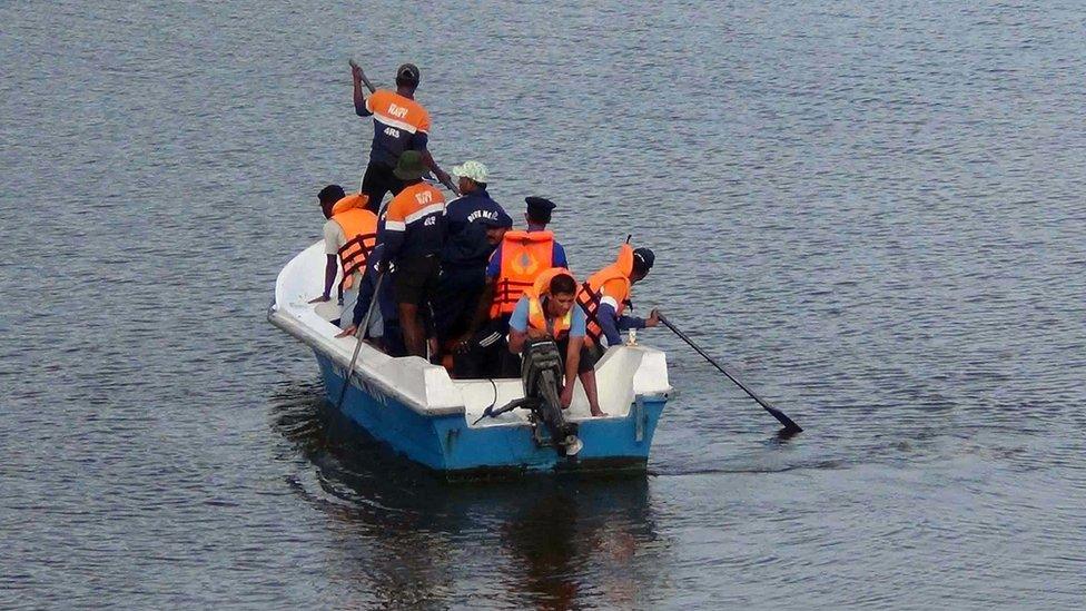 Sri Lankan officials were pictured searching for Mr McClean's body in a lagoon near the village of Panama, Sri Lanka