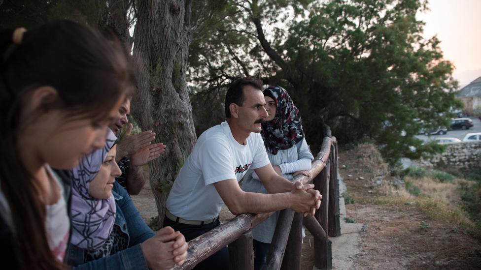 Ahmed surrounded by members of his family