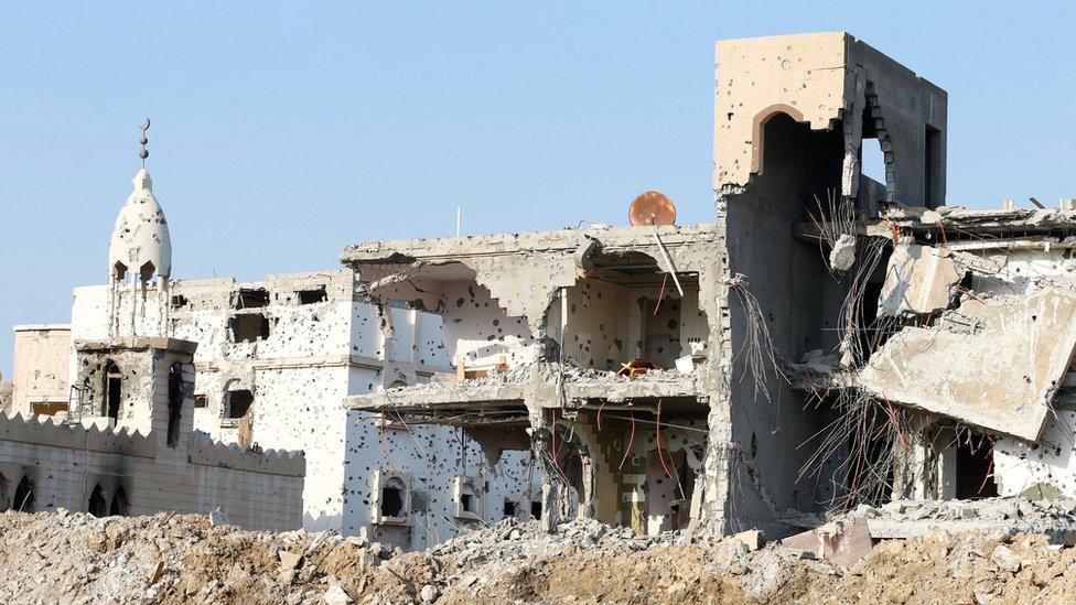 A damaged mosque and remains of buildings in Awamiya, Saudi Arabia (9 August 2017)