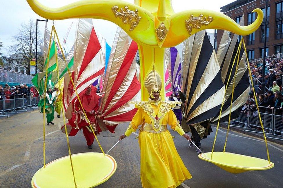 Man in parade dressed in yellow