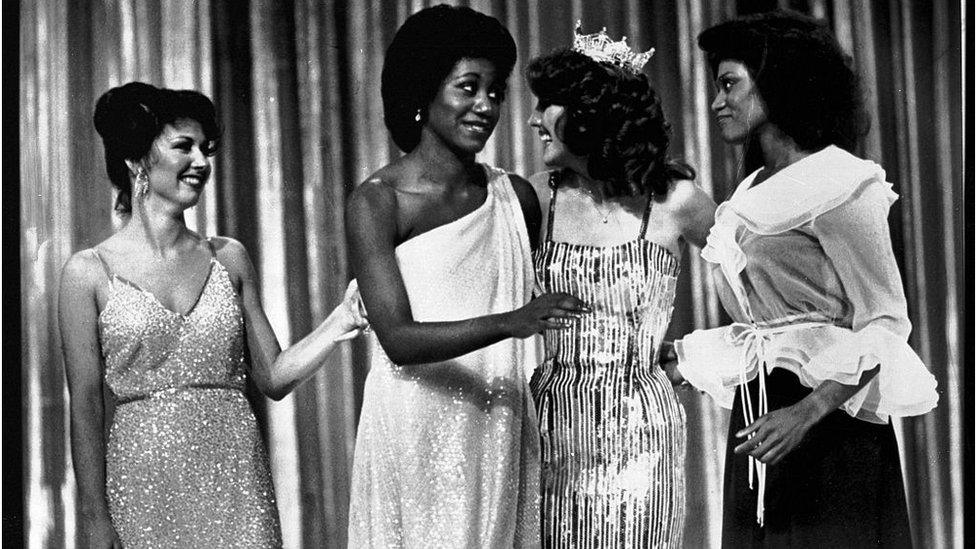 Miss Arkansas, Lencola Sullivan (C) and Miss Washington, Doris Janell Hayes (far R) give each other a glance after they became the first two Black women ever to win first place in the Miss America pageant. Arkansas won the swimsuit division and Washington split first with Miss Oklahoma, Susan Powell (far L) in the talent division.