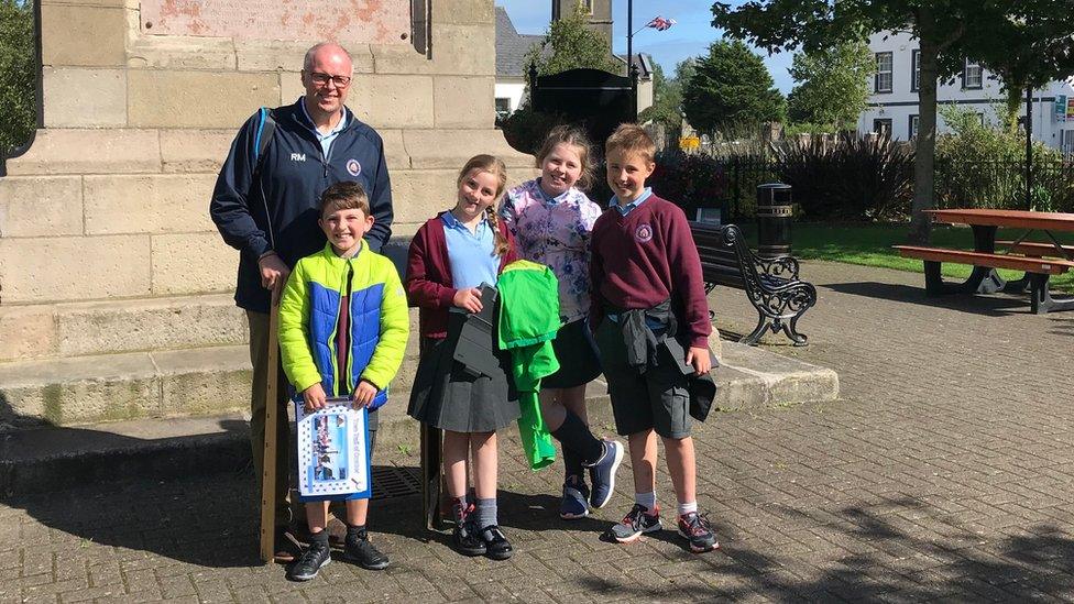 Outdoor Detectives Caleb, Caitie, Lois and Isaac exploring Comber with their principal