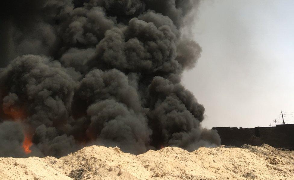 Oil fire shown near Qayyarah