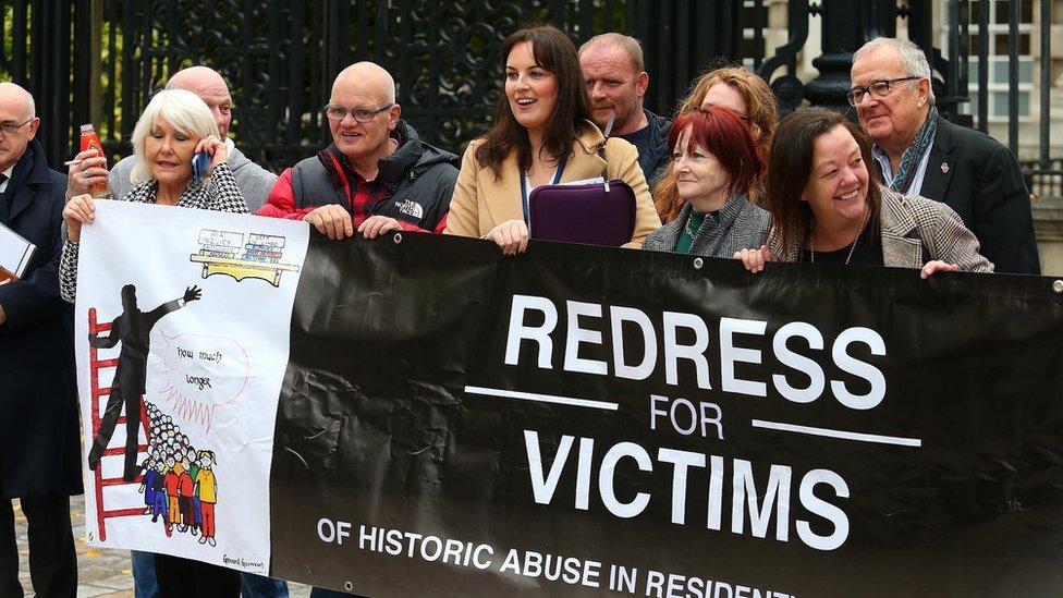 HIA campaigners holding banner