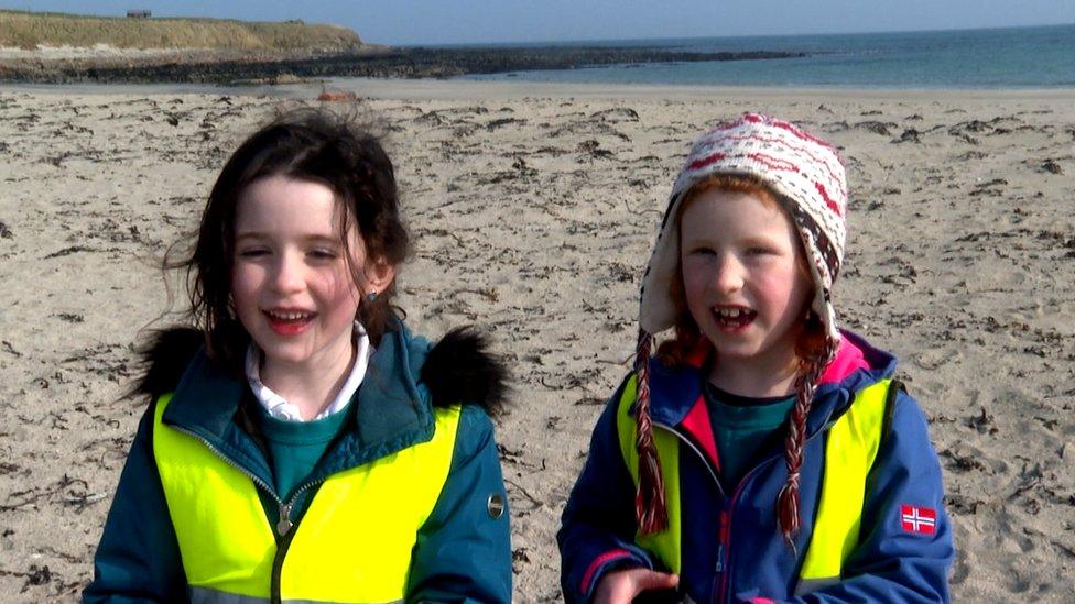 children cleaning the beach