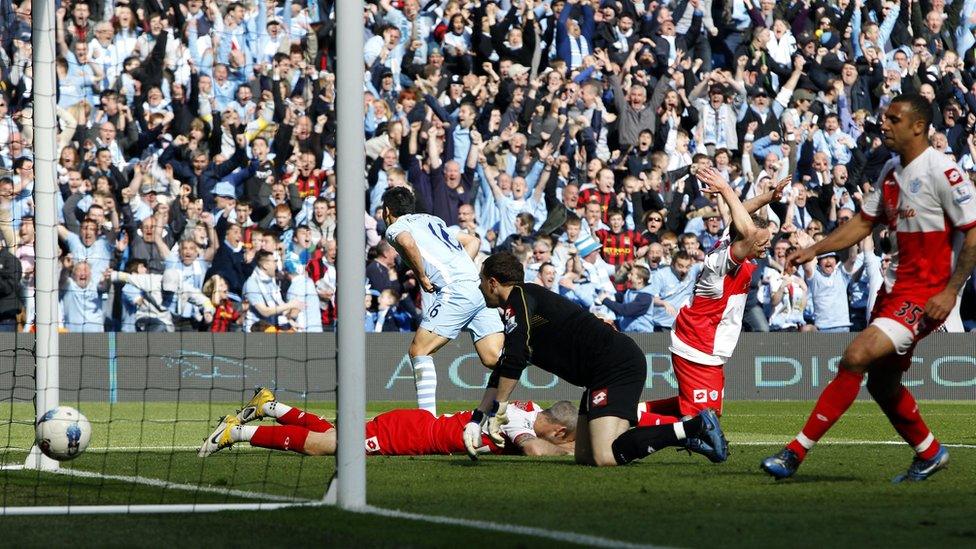 Manchester City's Sergio Aguero celebrates scoring against QPR on 13 May 2012