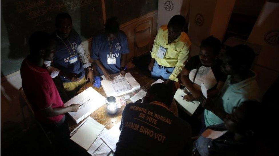 Electoral workers are seen during the counting at a polling station as Haiti holds a long-delayed presidential election after a devastating hurricane and more than a year of political instability, in Port-au-Prince, Haiti, November 20, 2016.