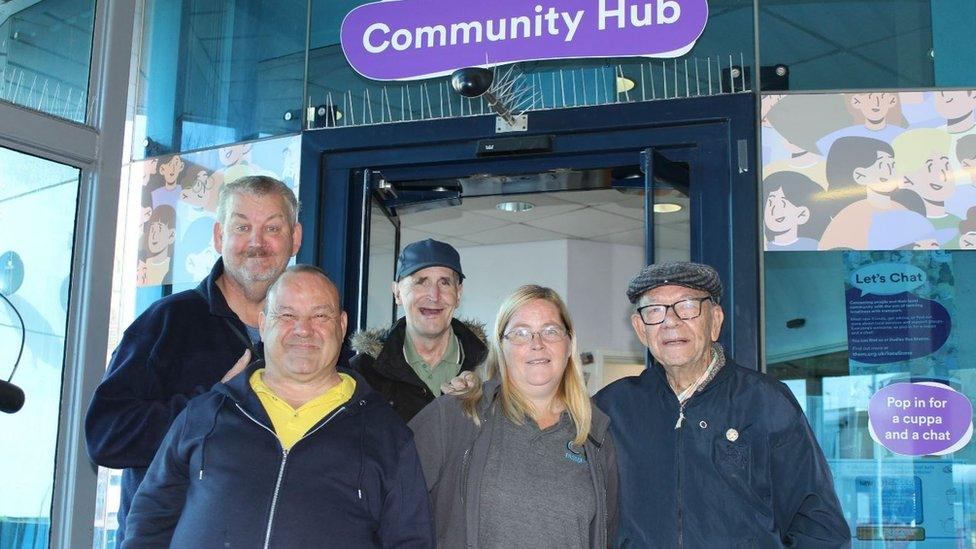 Let's Chat regulars at West Bromwich Bus Station Victor Harris, David Beaver, John Walters, and Bill North with volunteer Louise Colledge.