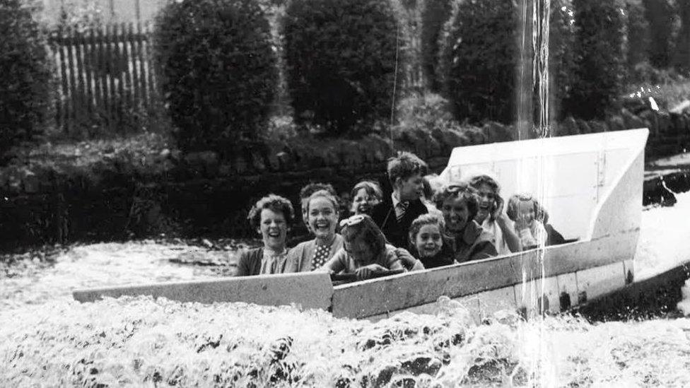 People on the water chute at Wicksteed Park