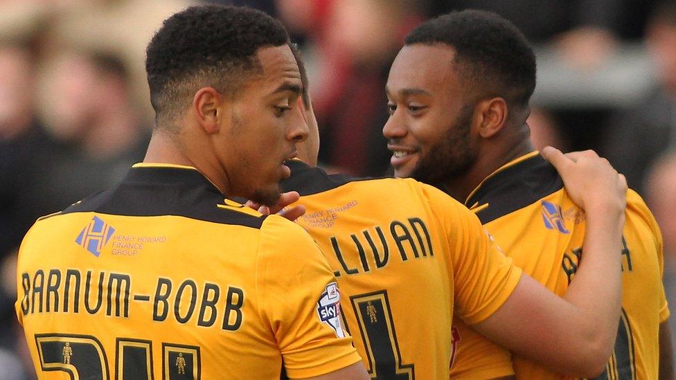 Zak Ansah (right) celebrates his goal fro Newport
