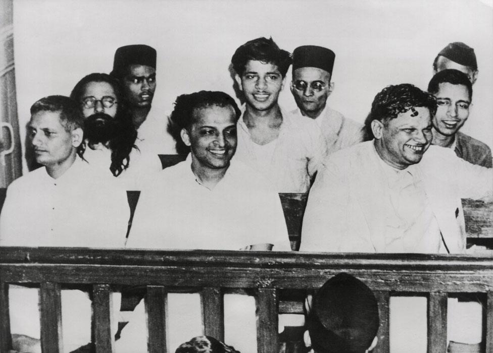 Front row, L-R: Nathuram Godse; Narayan Apte, Vishnu Karkare. 2nd Row, L-R: Digambar Ramchandra Badge (obscured); Shankar Kistaiya; Gopal Godse. 3rd Row: no ID; Vinayak Savarkar; S.D.Parchure. May 1948