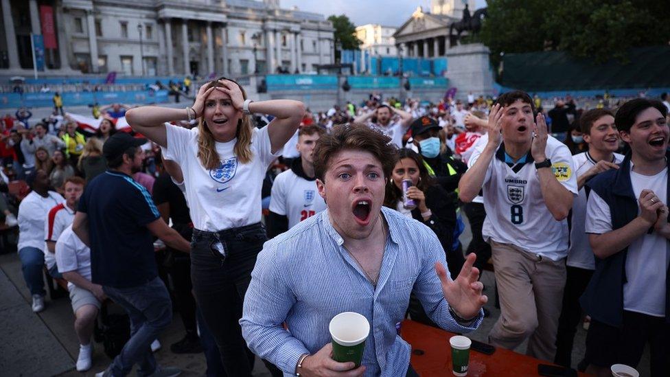 Fans gather in London ahead of Ukraine v England - London, Britain - July 3, 2021 England fans react in Trafalgar Square