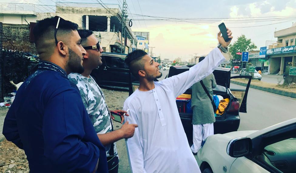 Secunder meets two Pakistani men with the distinctive skinfade hairstyle