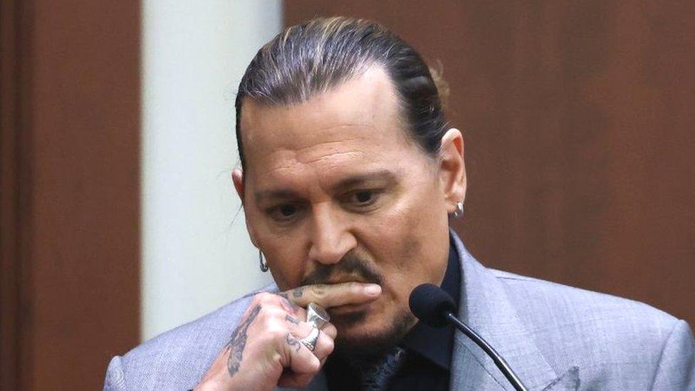 Actor Johnny Depp testifies during his defamation trial against his ex-wife Amber Heard at the Fairfax County Circuit Courthouse in Fairfax, Virginia, April 20, 2022