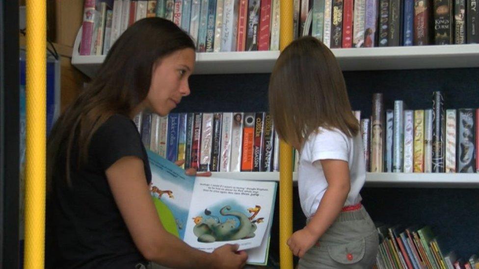 Woman and girl in mobile library