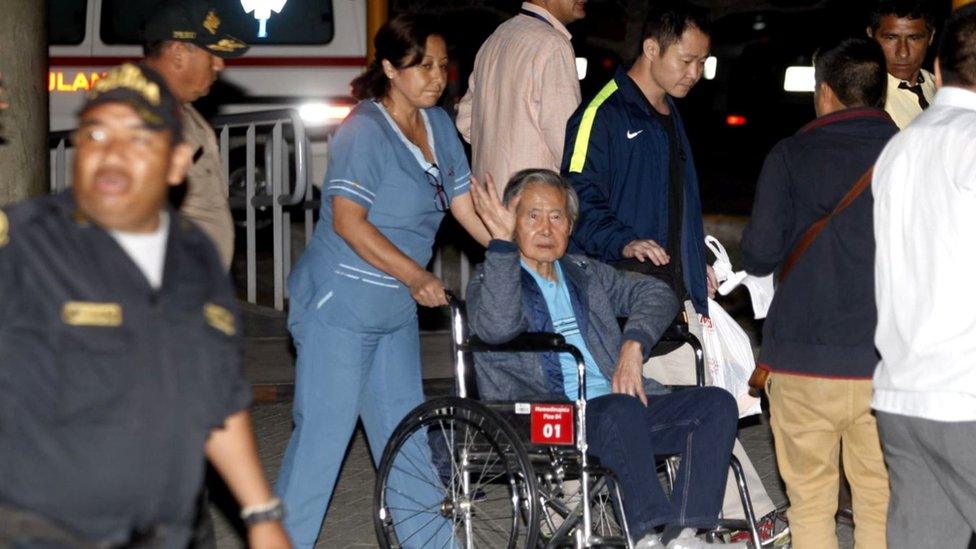 Former Peruvian President Alberto Fujimori accompanied by his son Kenji Fujimori (R) leaves the Centenario hospital in Lima, Peru, 4 January 2018.