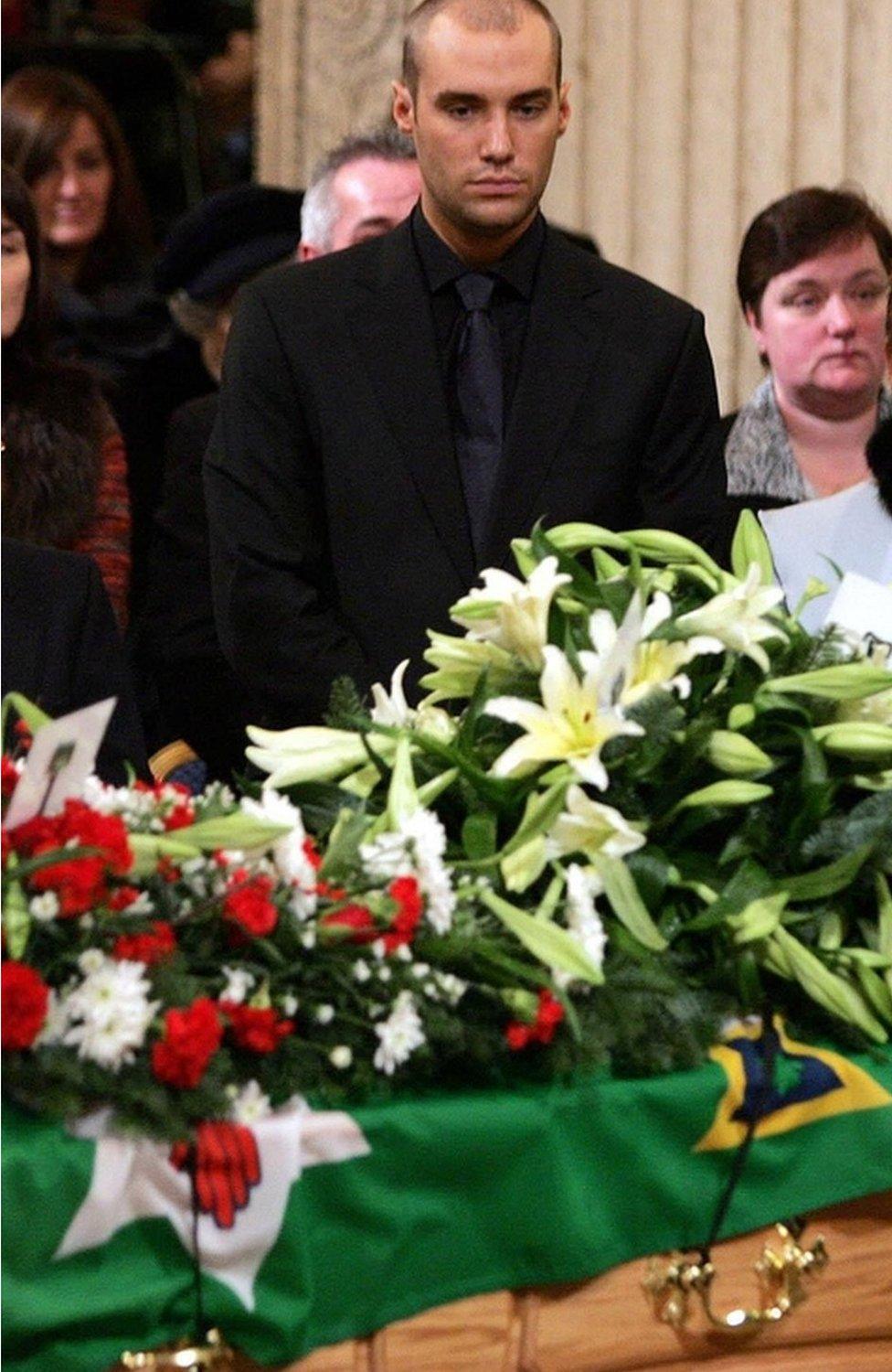 Son Calum Best attends his father's funeral service in Parliament Buildings in Stormont, Belfast