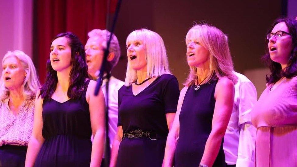 Caroline Edwards singing with her choir