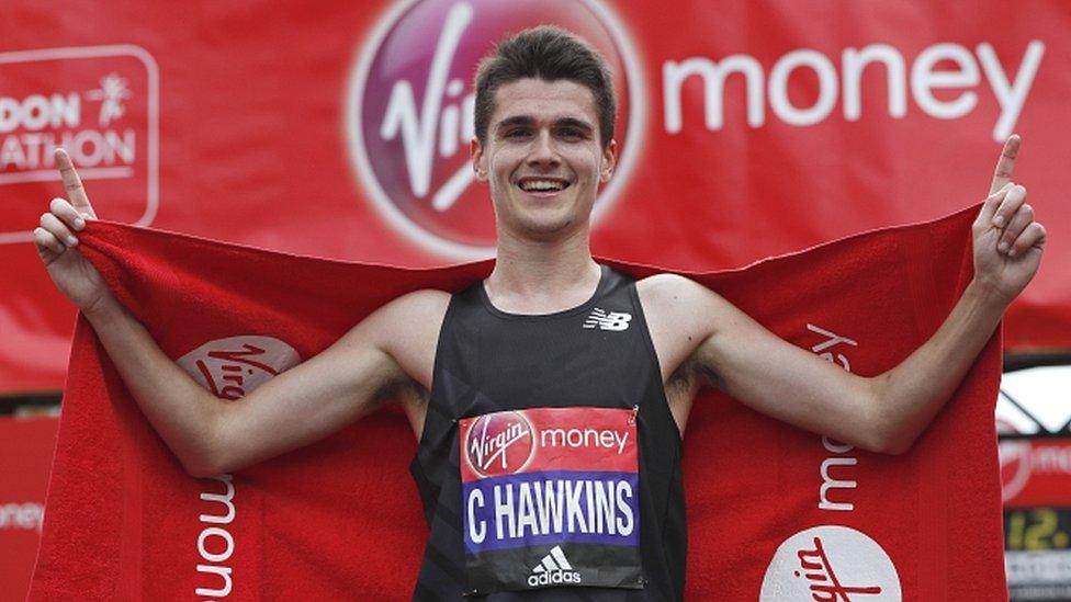 Callum Hawkins celebrates at the finish of the London Marathon