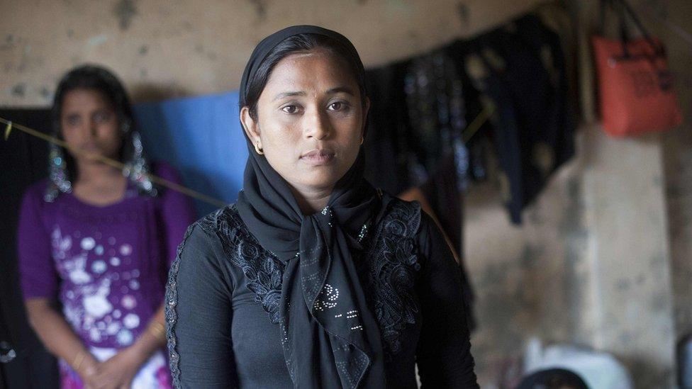 Kyaw Su Su Nw (centre), a Rohingya from Maungdaw in Rakhine, poses for a photo at the Taung Pyo temporary refugee camp, located near the Bangladesh border, in the Myanmar state of Rakhine on 7 June 2015.