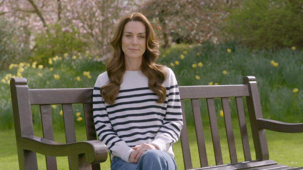 The Princess of Wales sits on a bench