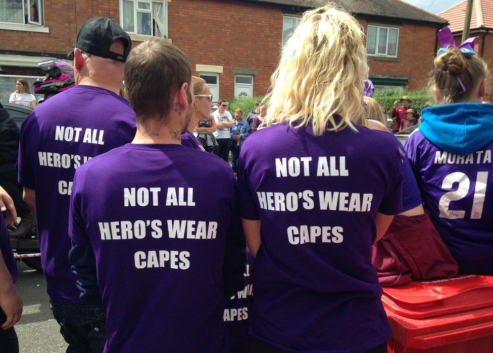 People wearing t-shirts in memory of Owen Jenkins