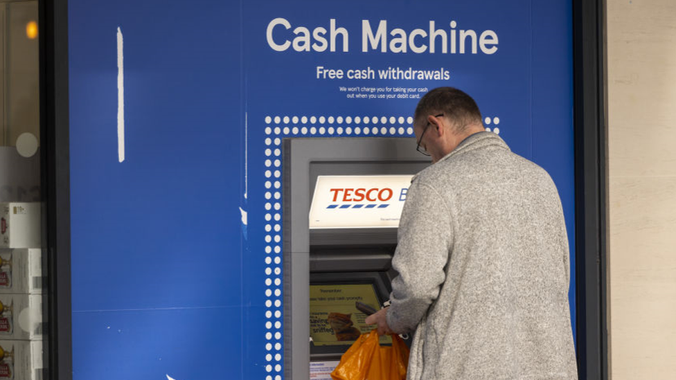 Man at Tesco Bank ATM