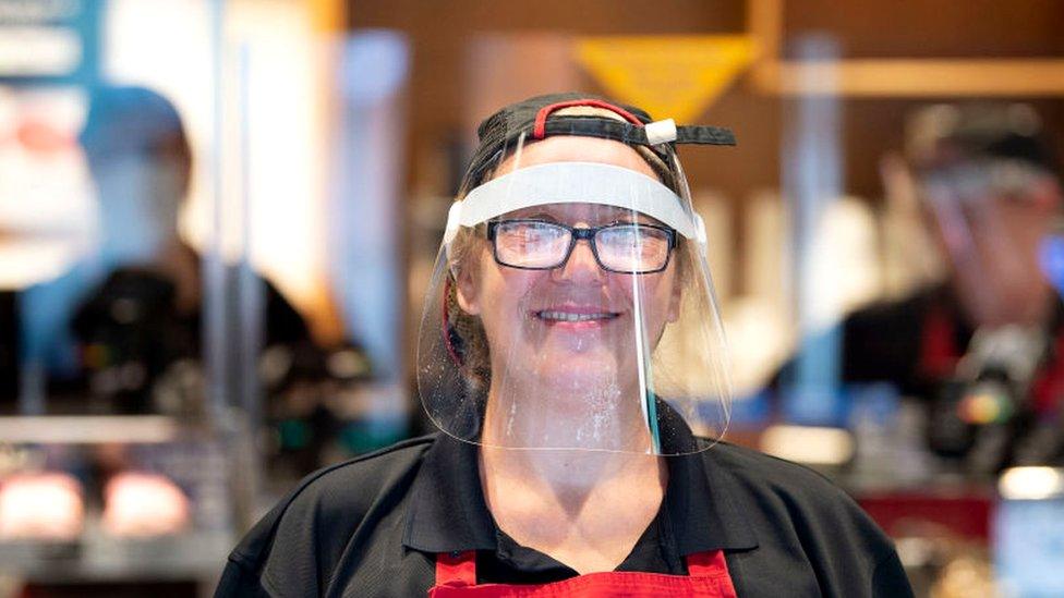 Shop worker wearing a visor