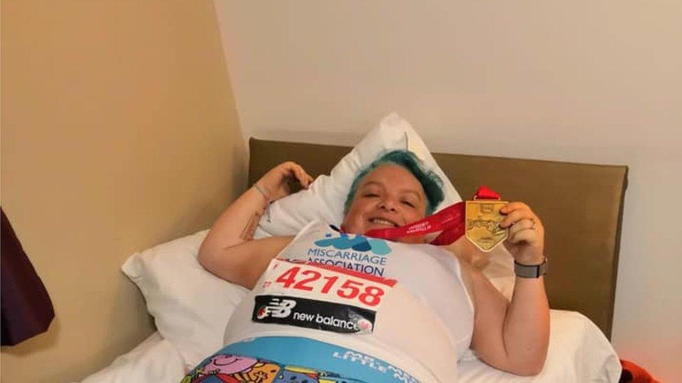 Kerrie Aldridge lying on the bed after the race