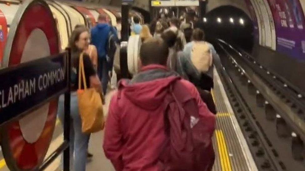 Passengers walking out of Clapham Common station