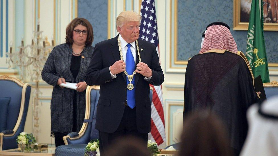 US President Donald Trump (C) receives the Order of Abdulaziz al-Saud medal from Saudi Arabia"s King Salman bin Abdulaziz al-Saud