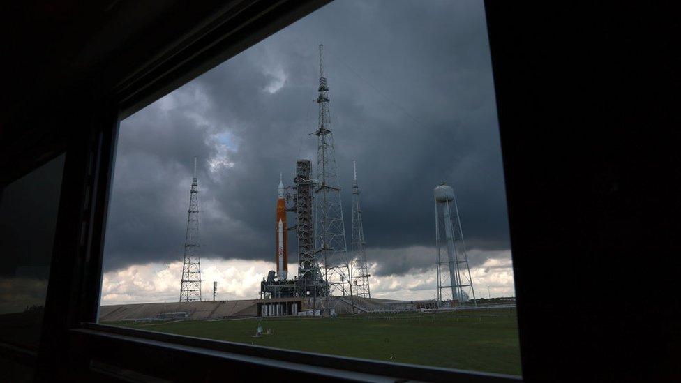 Artemis rocket seen through a window.