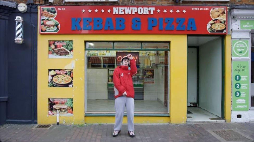 Niko B outside a kebab shop