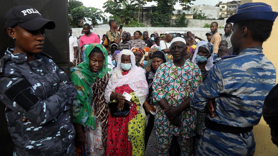 People wait to cast their votes during the presidential election in Abidjan, Ivory Coast, 31 October, 2020.