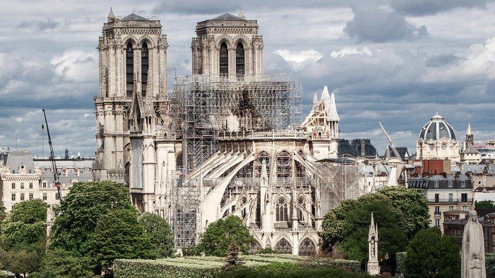 A general view of the East face of Notre-Dame Cathedral and the Seine river in Paris