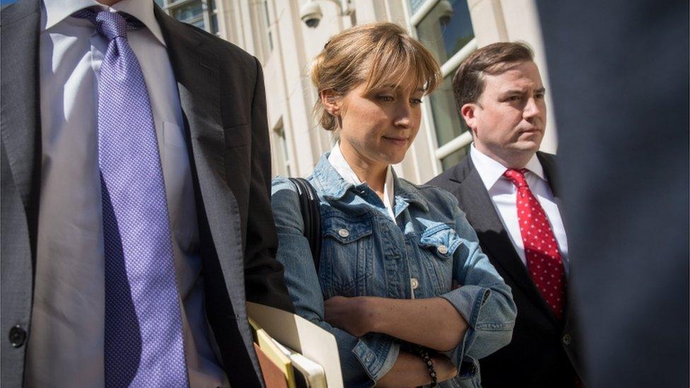 Allison Mack exiting court house with lawyers