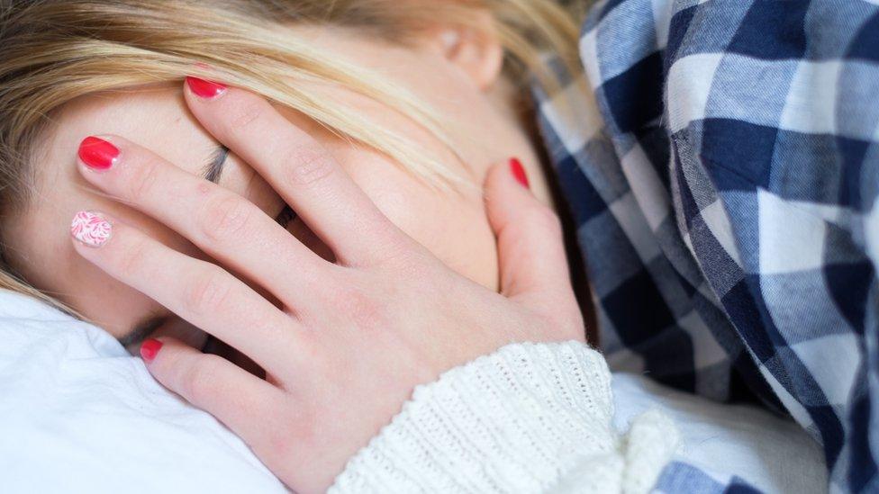 Woman covering her face