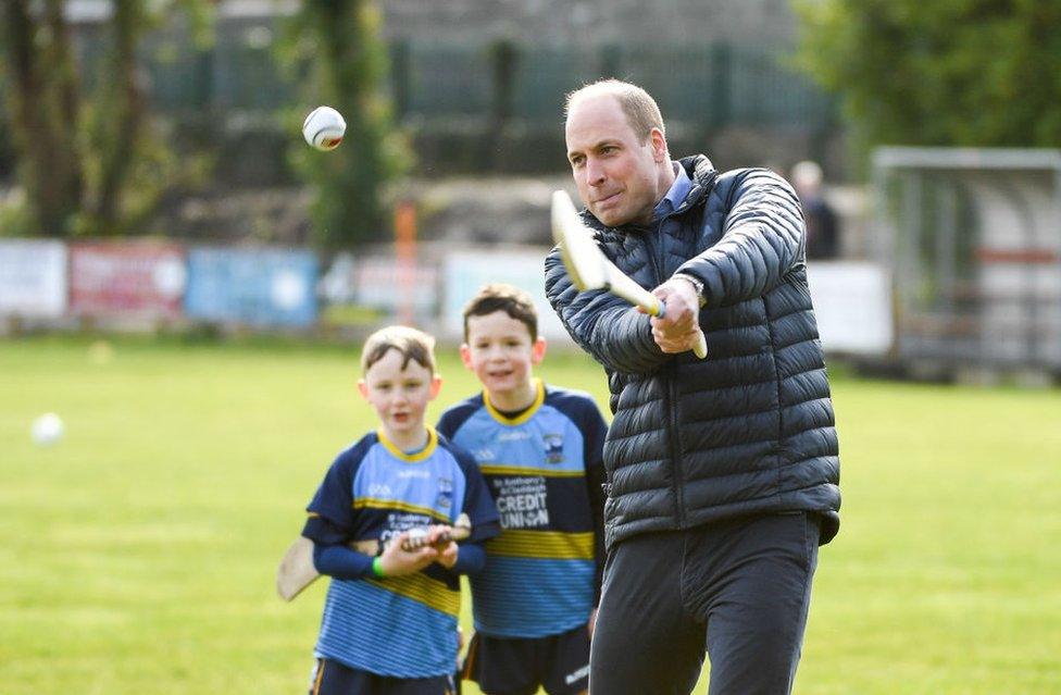 William hits a ball as he tries hurling during the visit to Salthill Knocknacarra GAA club