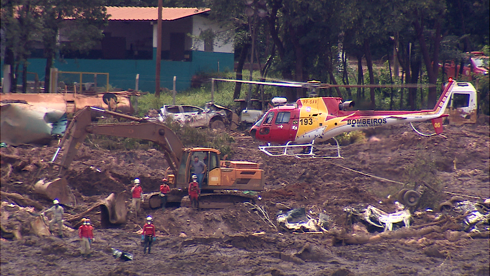 Helicopter hovers over mud slide in Brazil