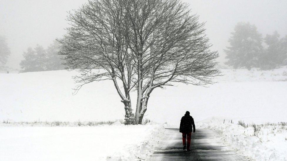 A man walks along a path at Gleneagles golf course in Scotland on 14 January 2021