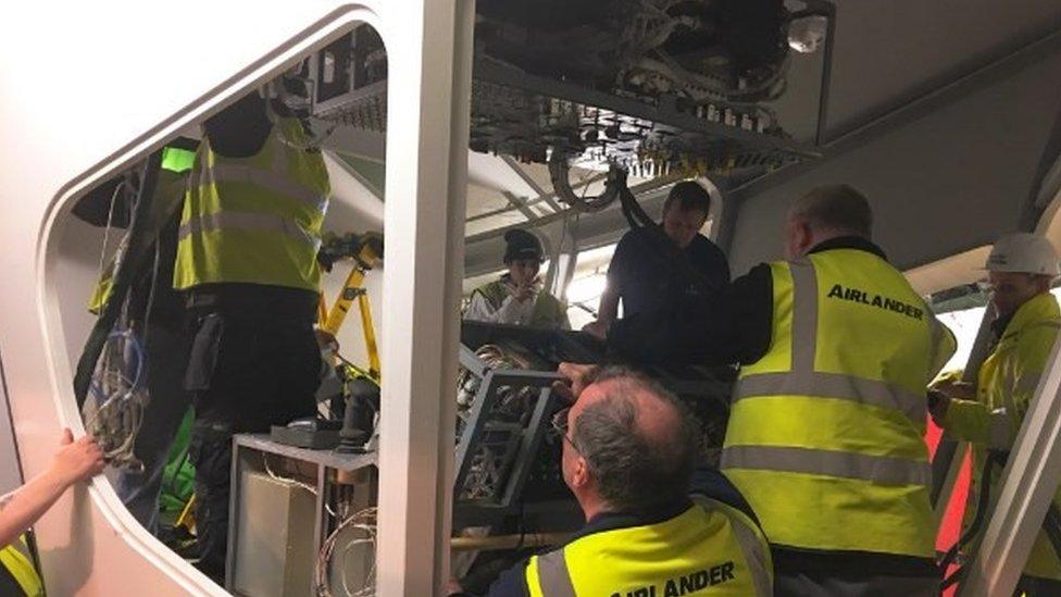 Engineers installing flight controls into the Airlander 10 cockpit