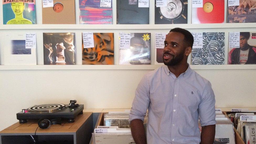 man stands in record shop