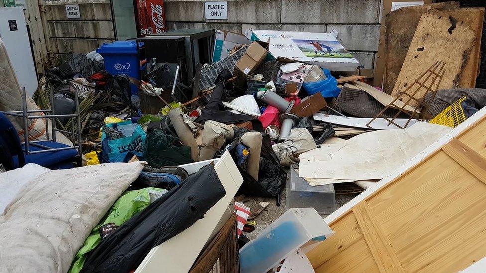 A pile of illegally-dumped rubbish in Denbighshire