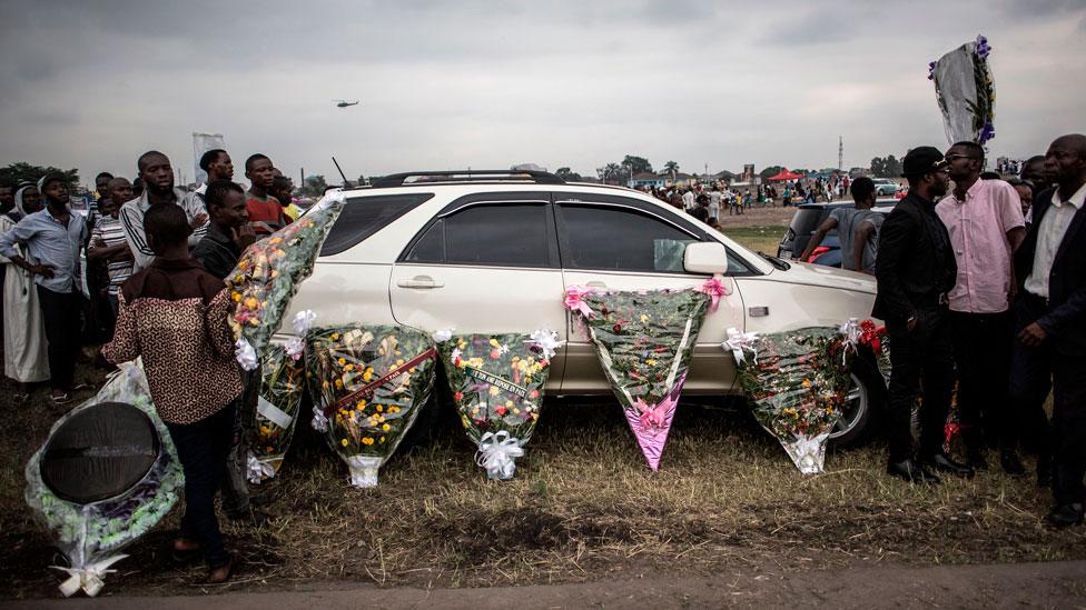 Flower arrangements are displayed for sale during the mourning ceremony of late former DR Congo Prime Minister and opposition leader Etienne Tshisekedi in Kinshasa, on May 31, 2019.