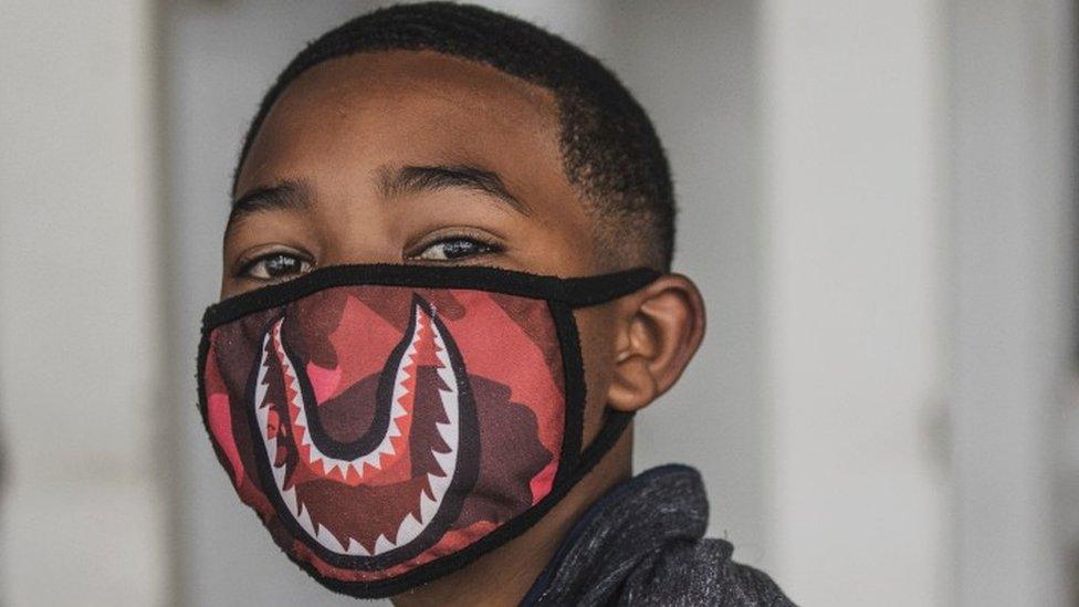 A boy wears a facemask in Soweto, Johannesburg, in 2020.